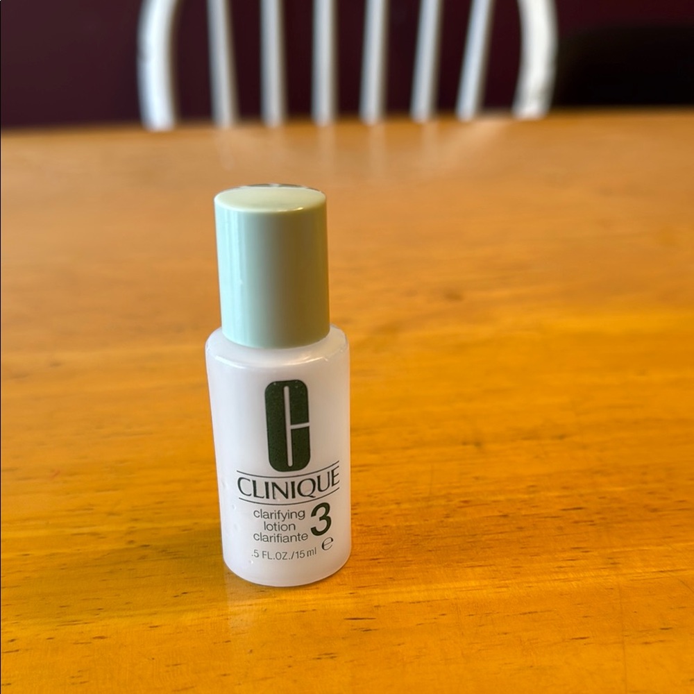Empty Clinique .5 ounce plastic container for clarifying lotion.